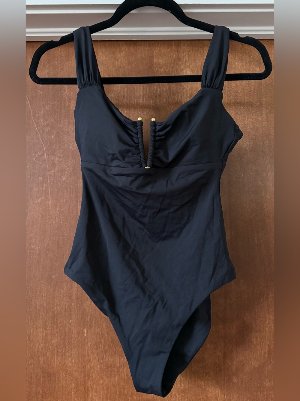 BECCA Black One-Piece Swimsuit with Gold Accents